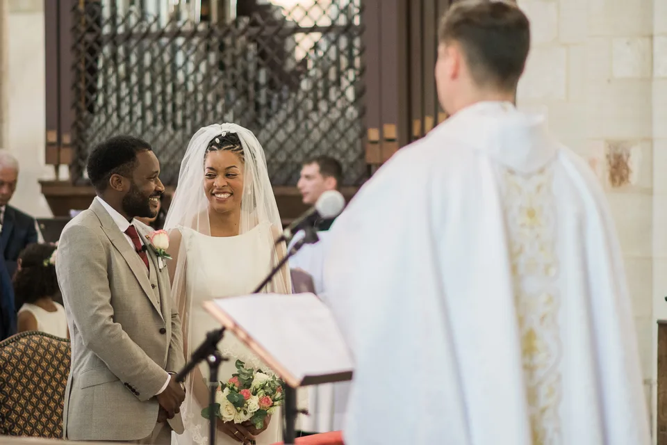 Newlyweds facing the celebrant in church