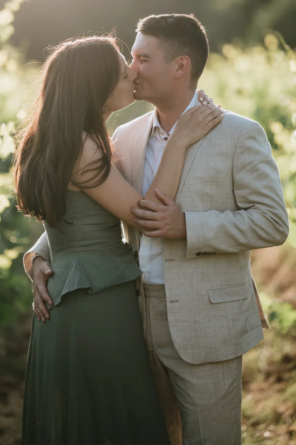 A couple embracing in tall grasses