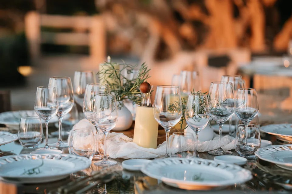 A table set in the warm light of dinner