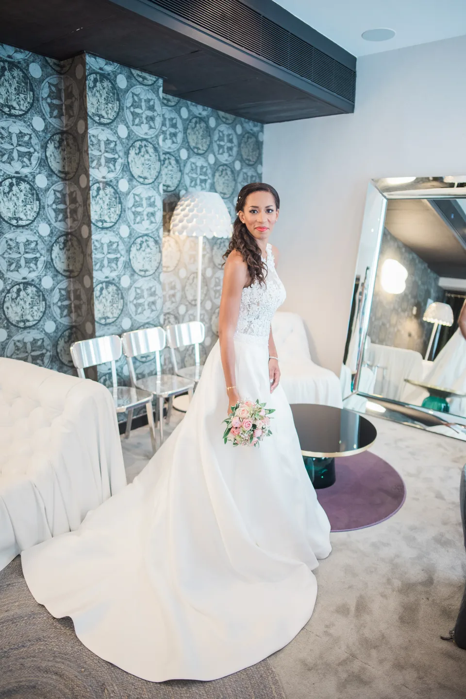 The bride twirling her dress in a bright room