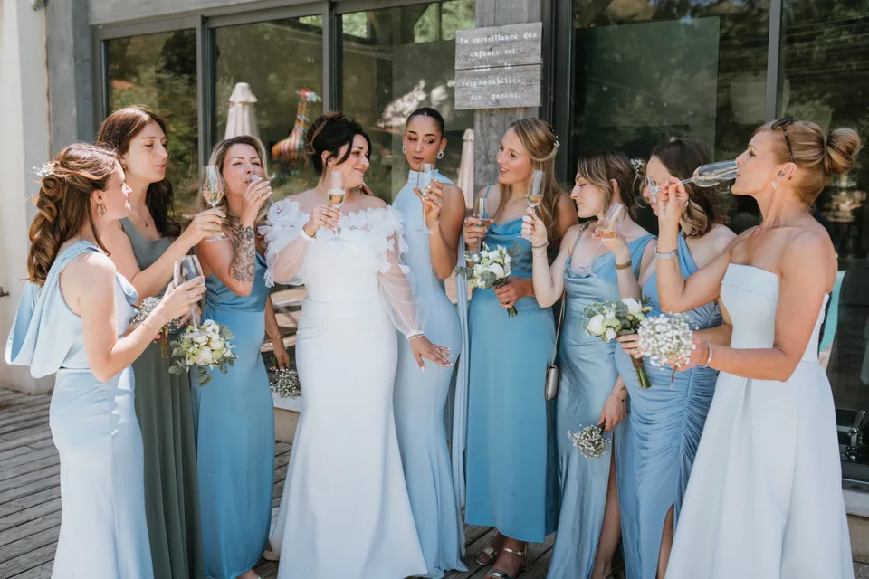 The bride laughing with guests during preparations