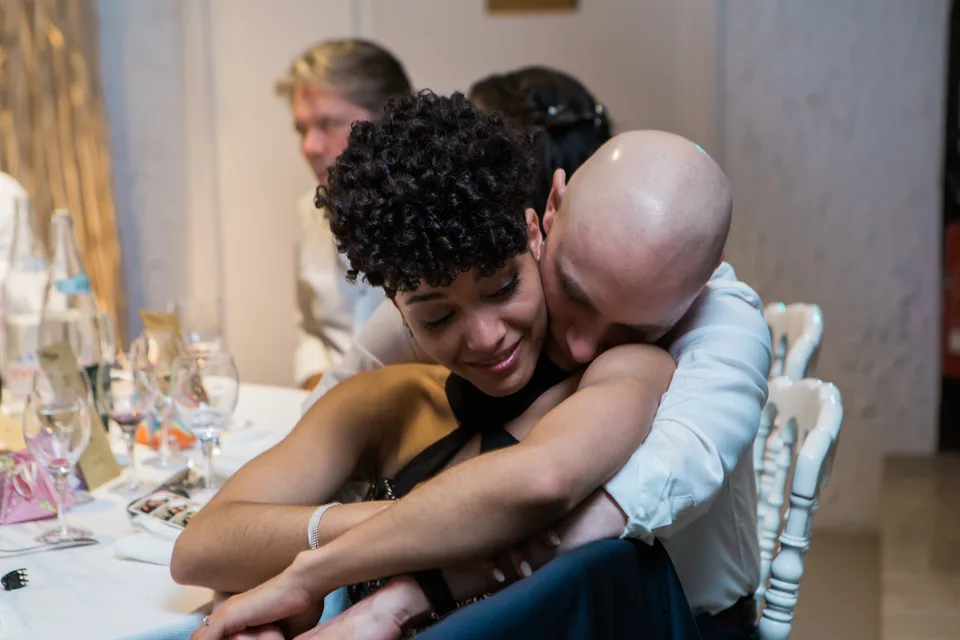 An embrace at the dinner table