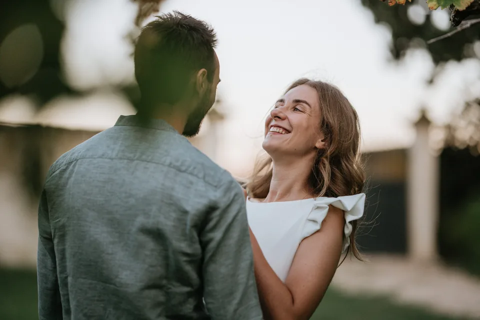 A couple sharing a smile in the garden