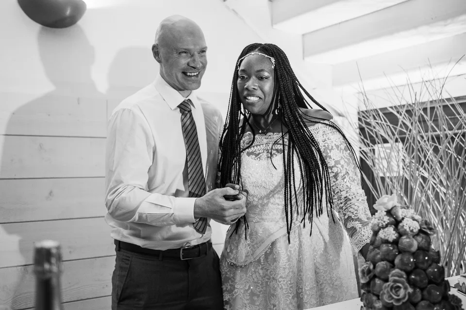 Newlyweds dancing together, in black and white