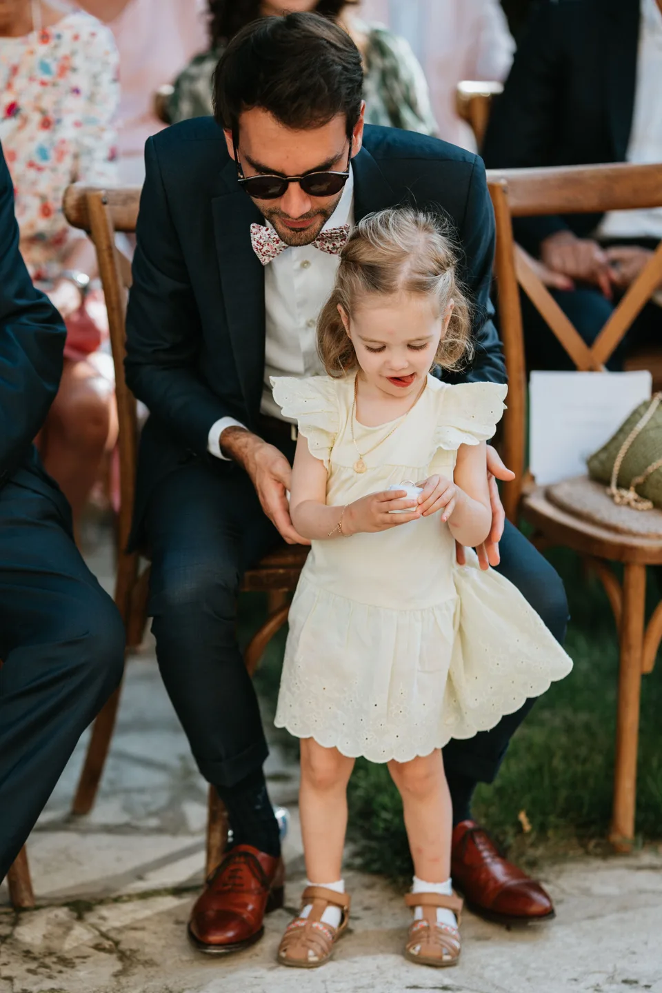 A guest leaning towards a child