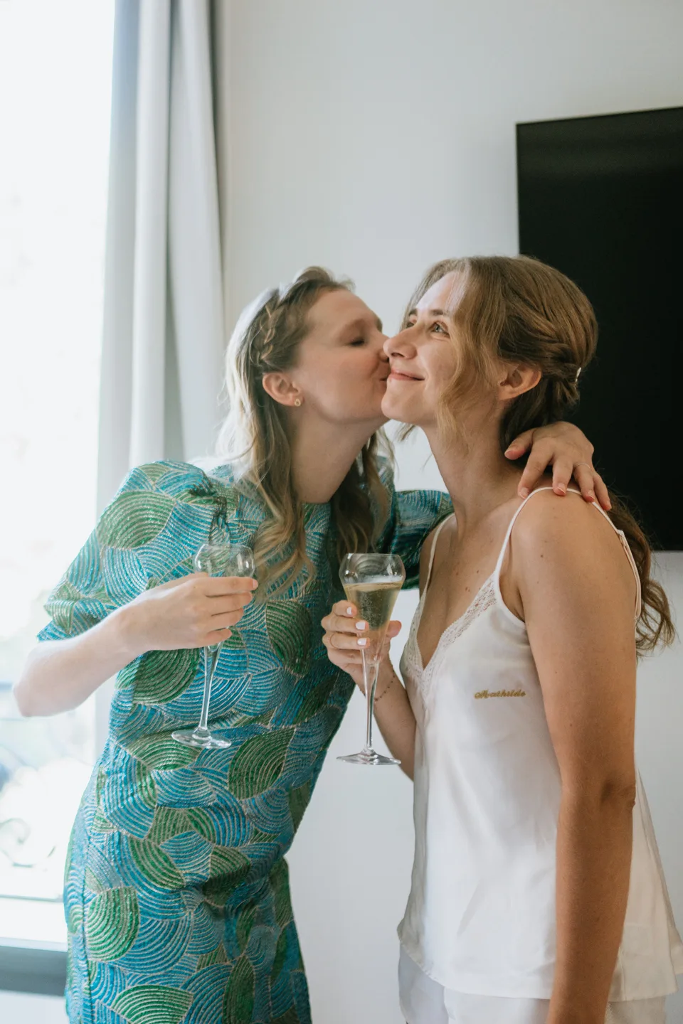 A kiss on the cheek during preparations
