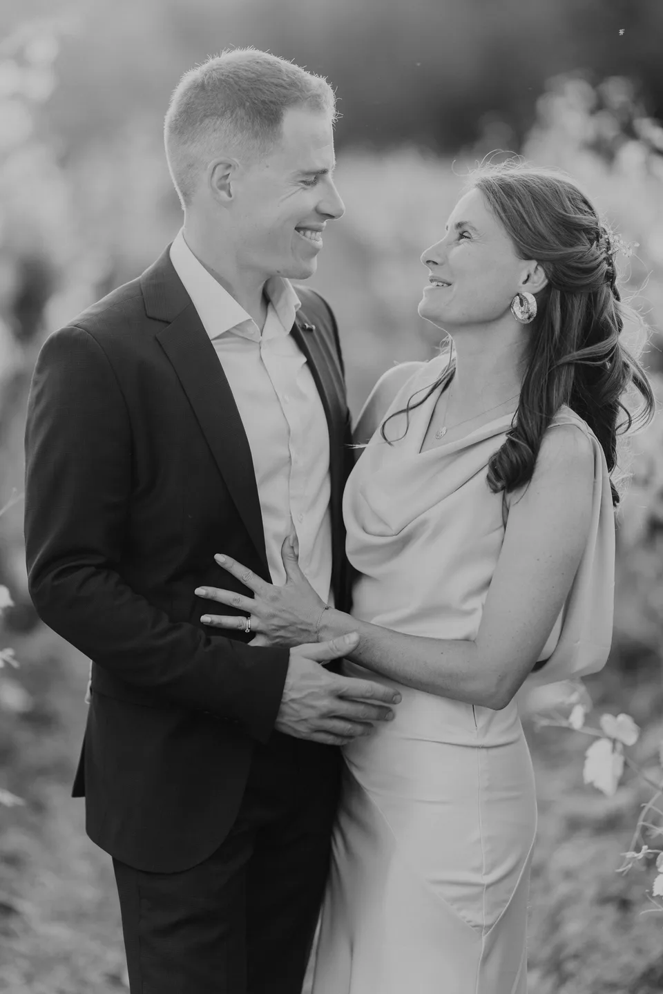 A couple embracing, photographed in black and white