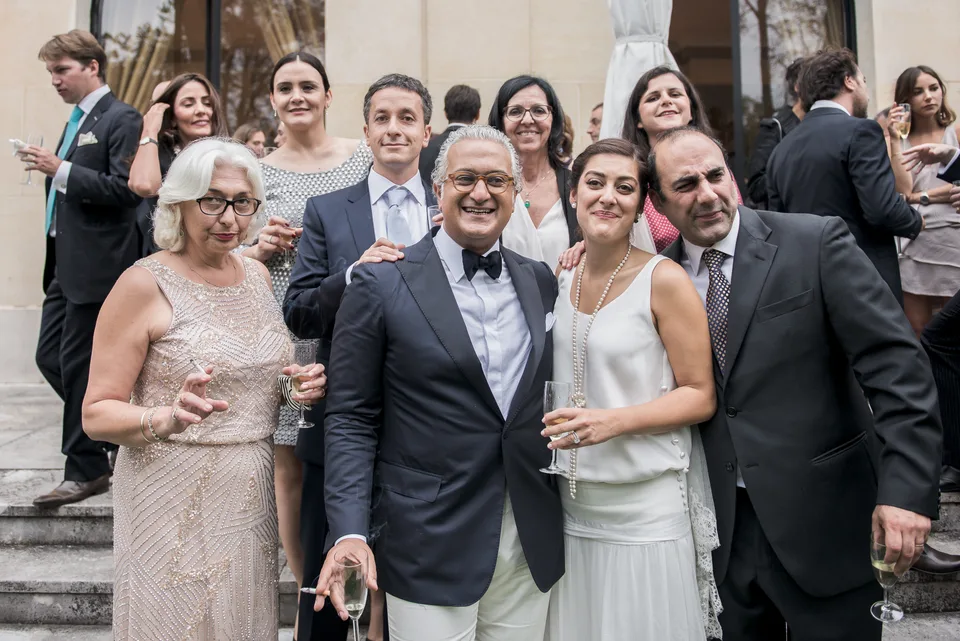 The bride surrounded by guests on the steps