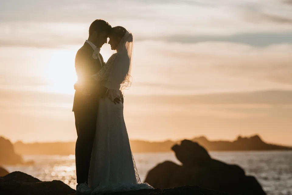 A silhouetted kiss against the sunset