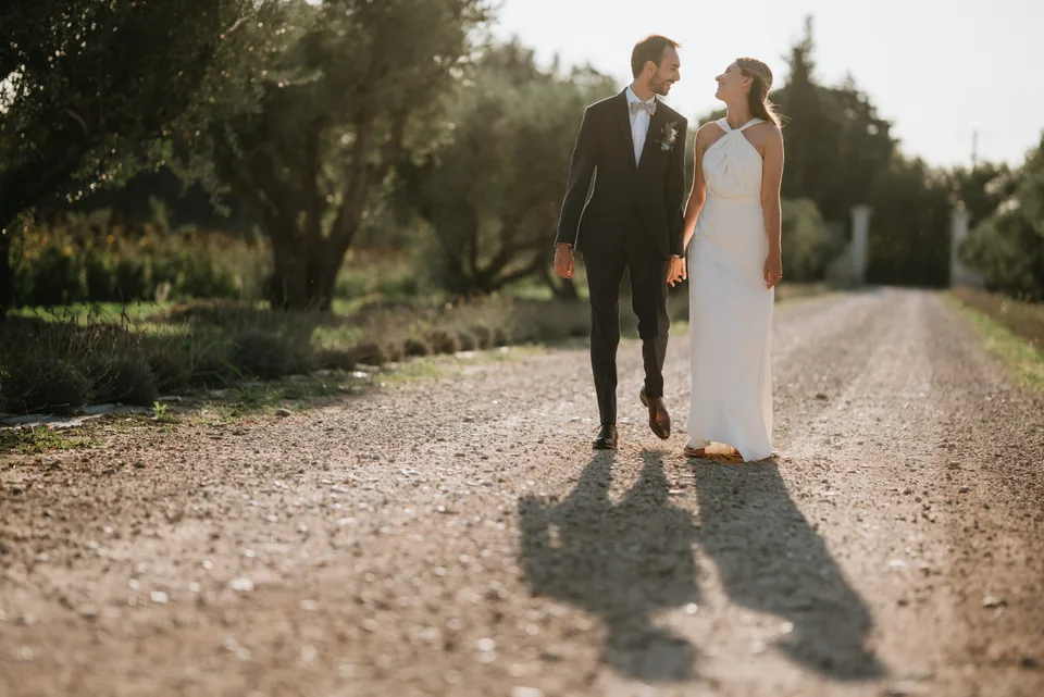 Newlyweds walking in low sunlight