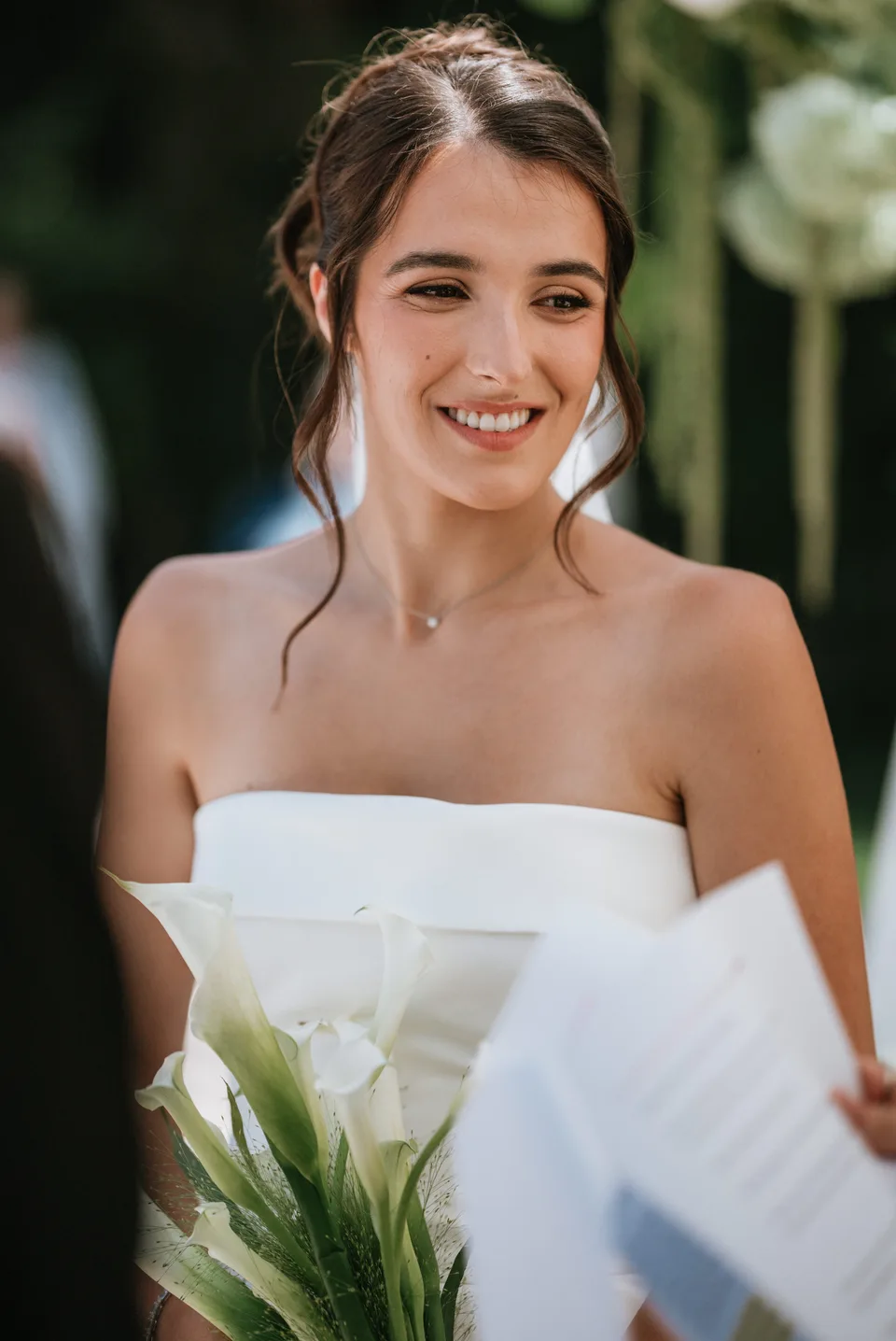 The bride smiling in the garden