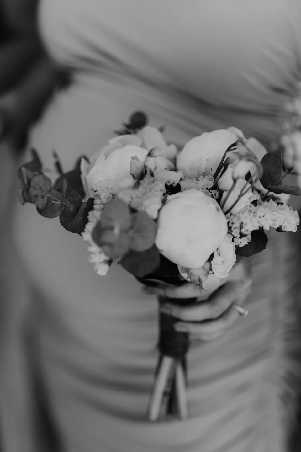 A bridal bouquet photographed in black and white