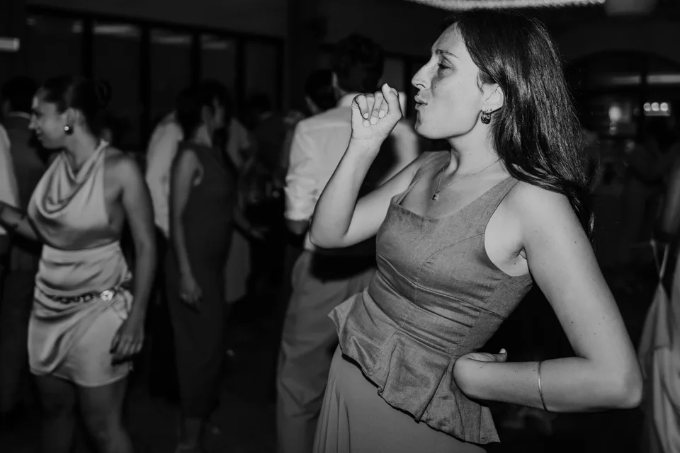 A guest on the dance floor in black and white