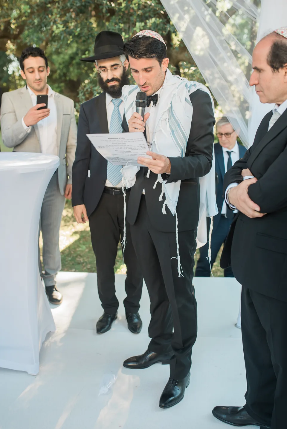 A guest reading to the newlyweds
