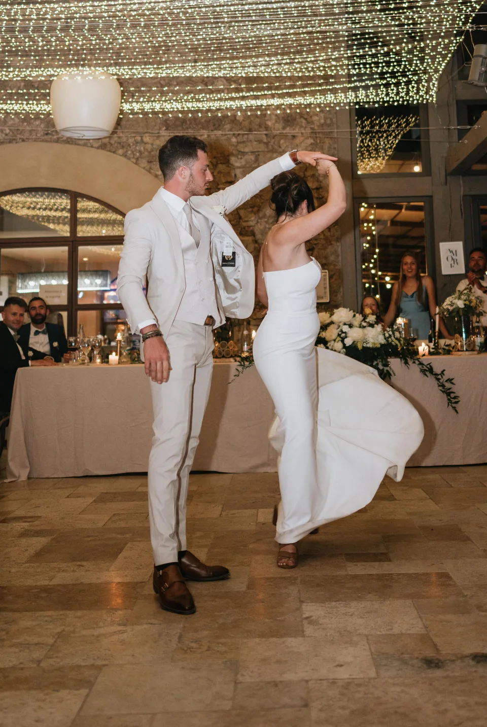 Newlyweds twirling on the dance floor