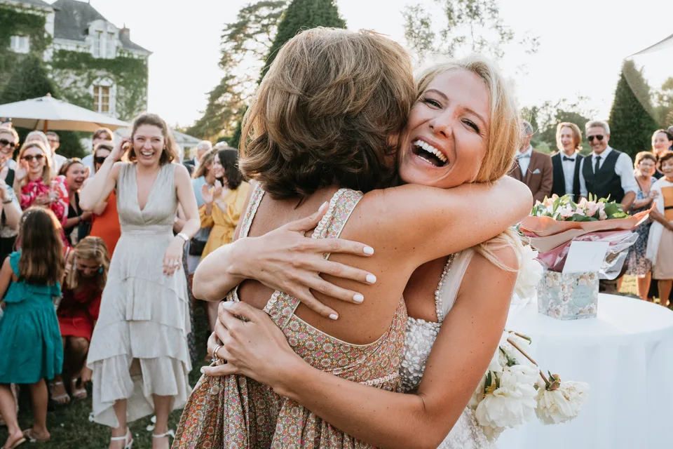 A joyful embrace among the guests