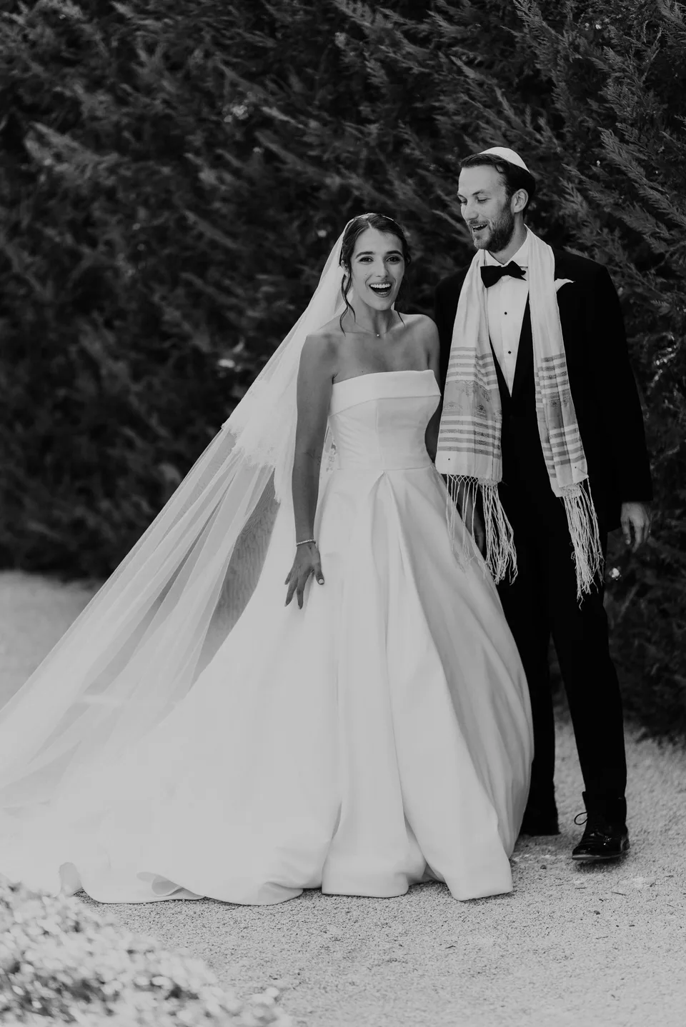 Newlyweds in the garden in black and white