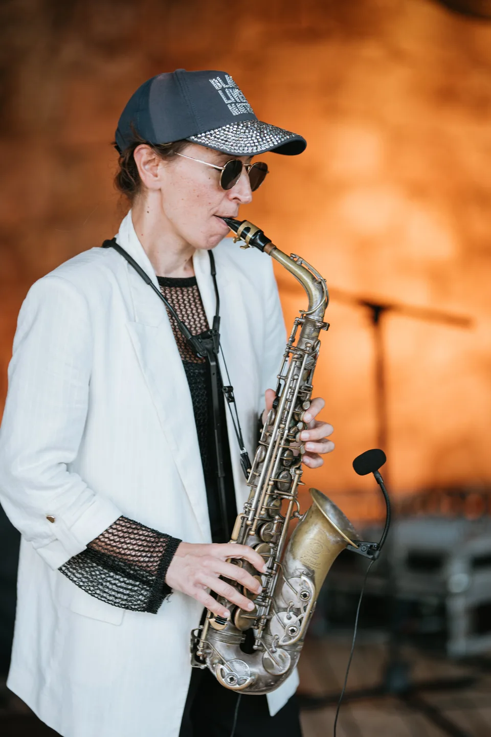 A musician playing saxophone at the reception
