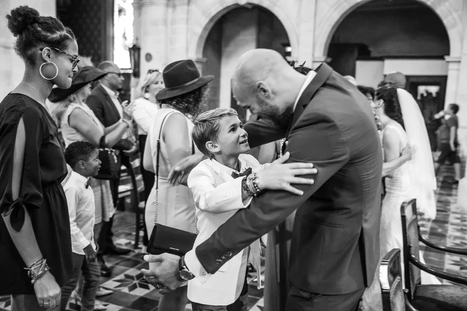 An embrace after the ceremony, in black and white