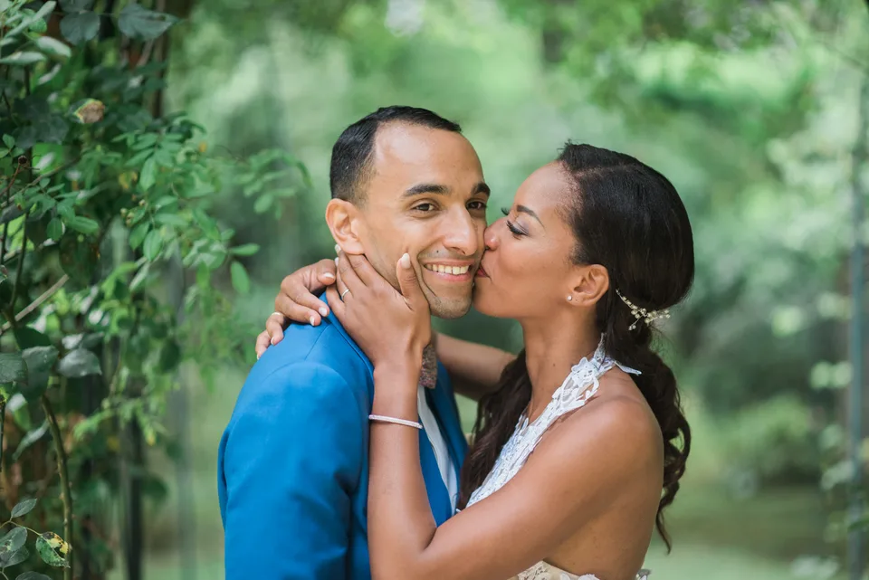 Newlyweds kissing in the garden