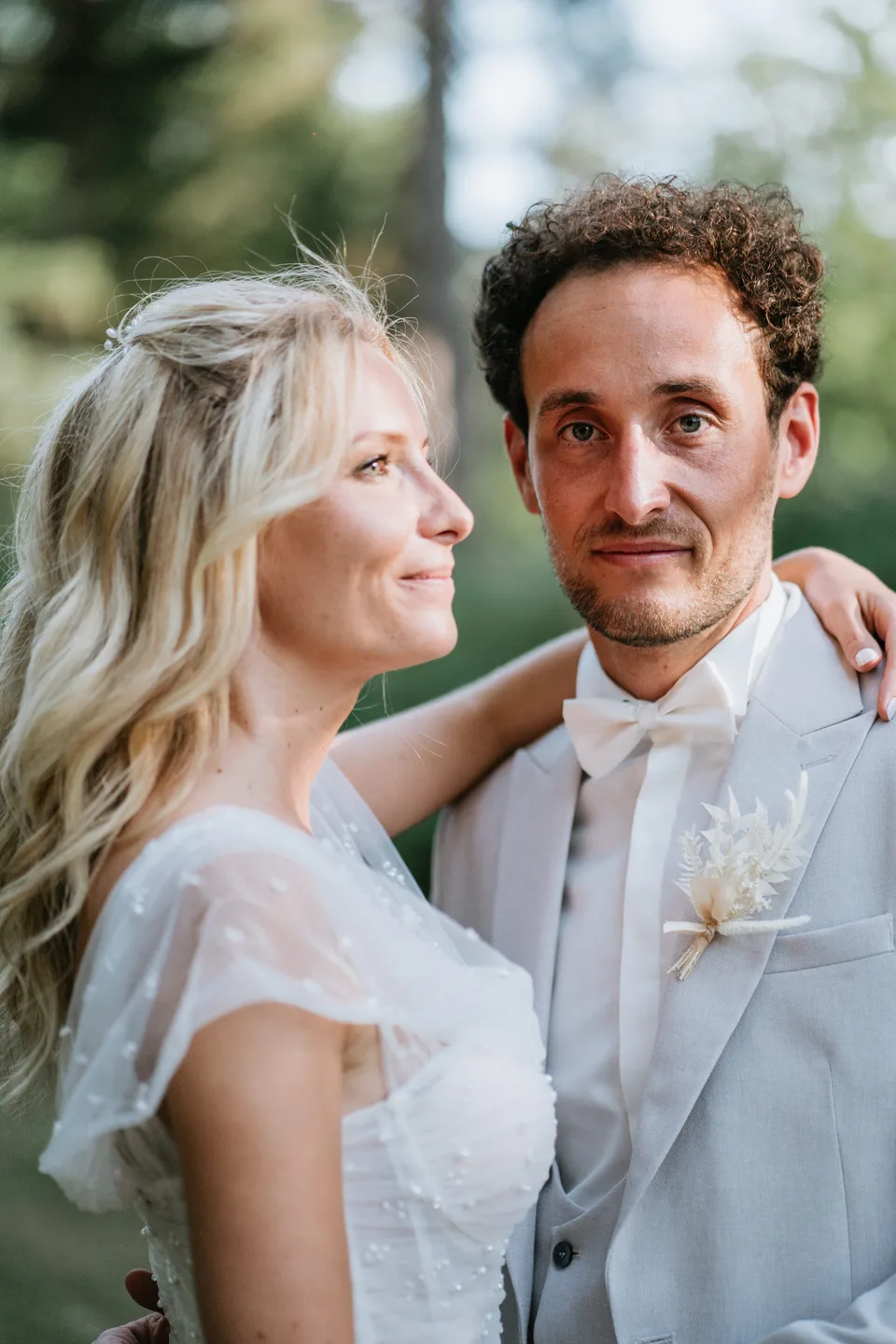 A couple sharing a smile in front of guests