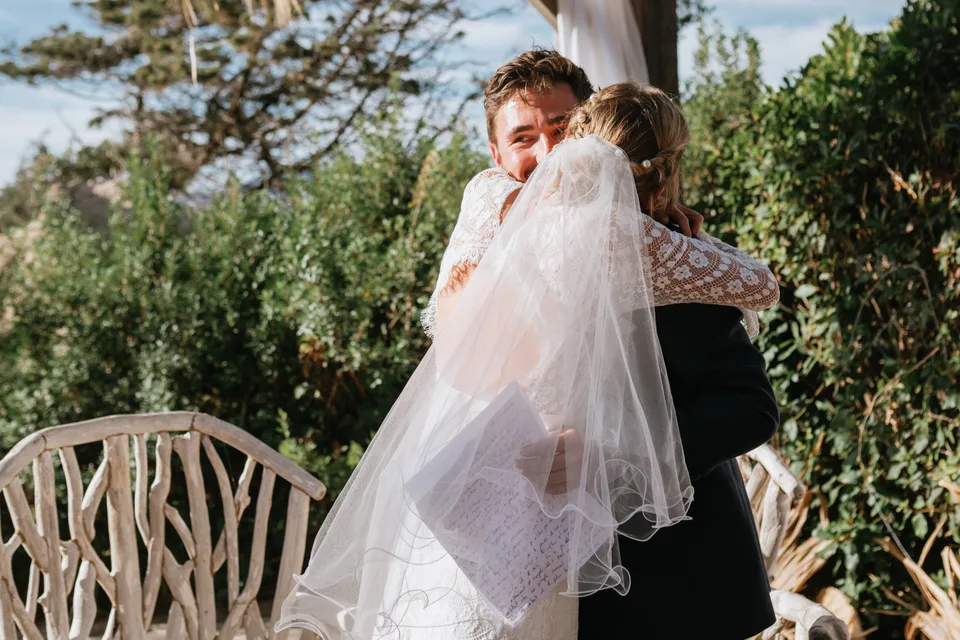 The bride sharing an embrace in the garden
