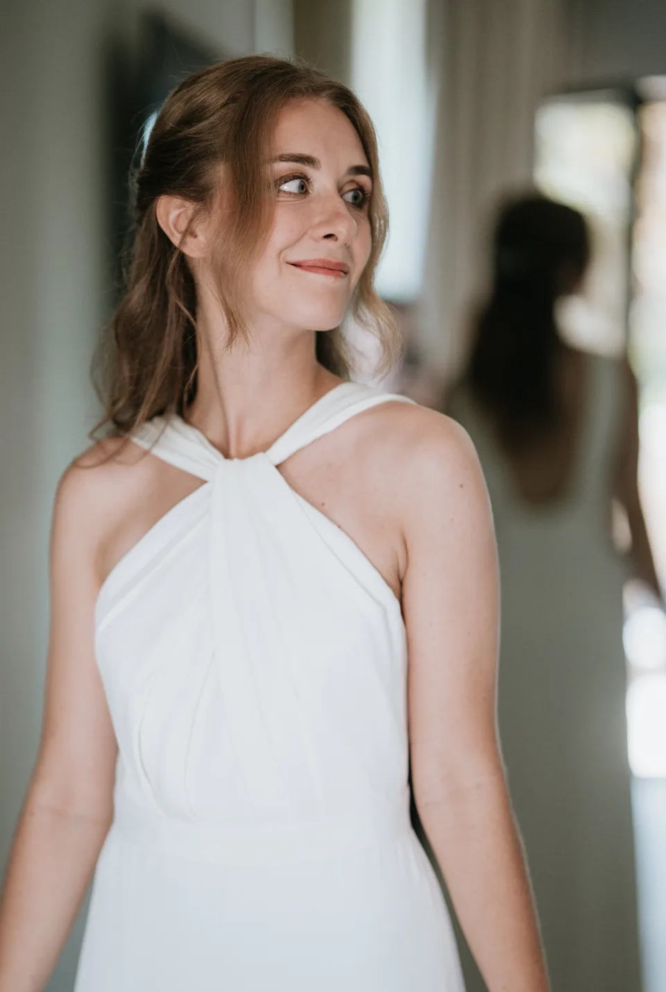 The bride looking through a window