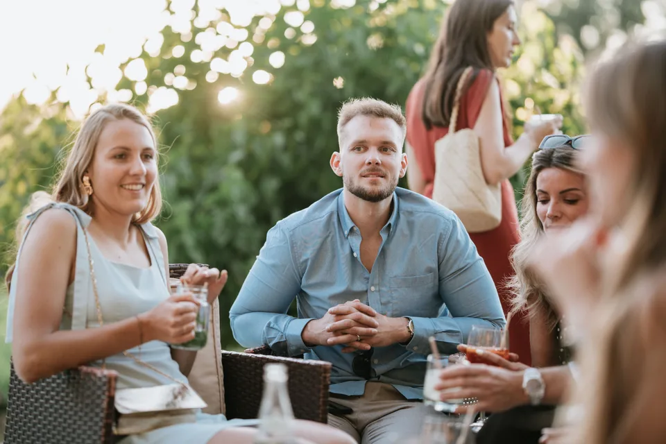 Two guests talking during the drinks reception