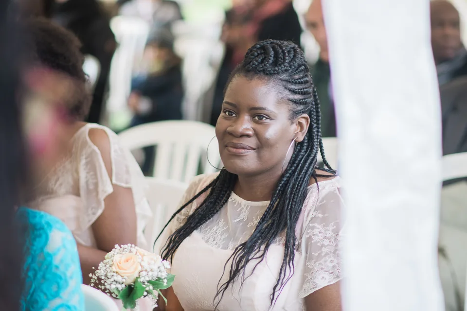 A guest smiling during the drinks reception