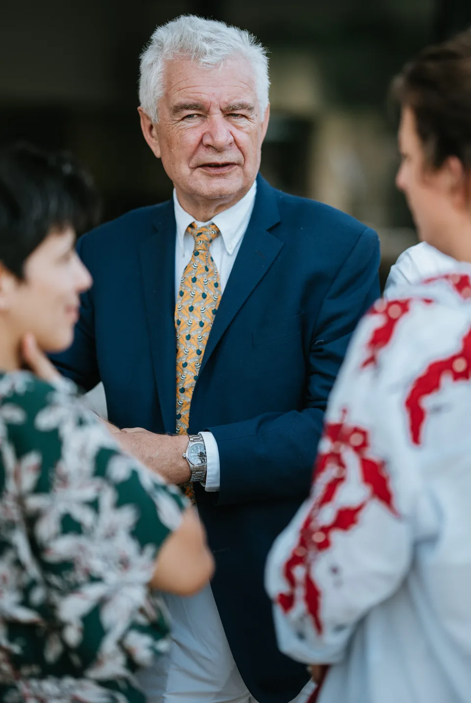 A guest smiling among the conversations
