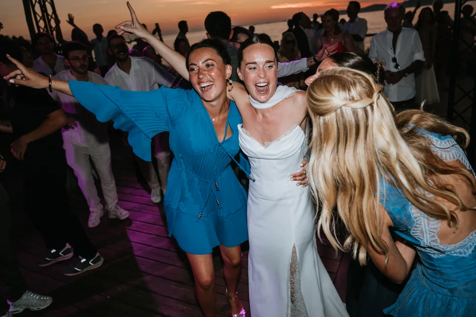 The bride smiling in the middle of the dance floor