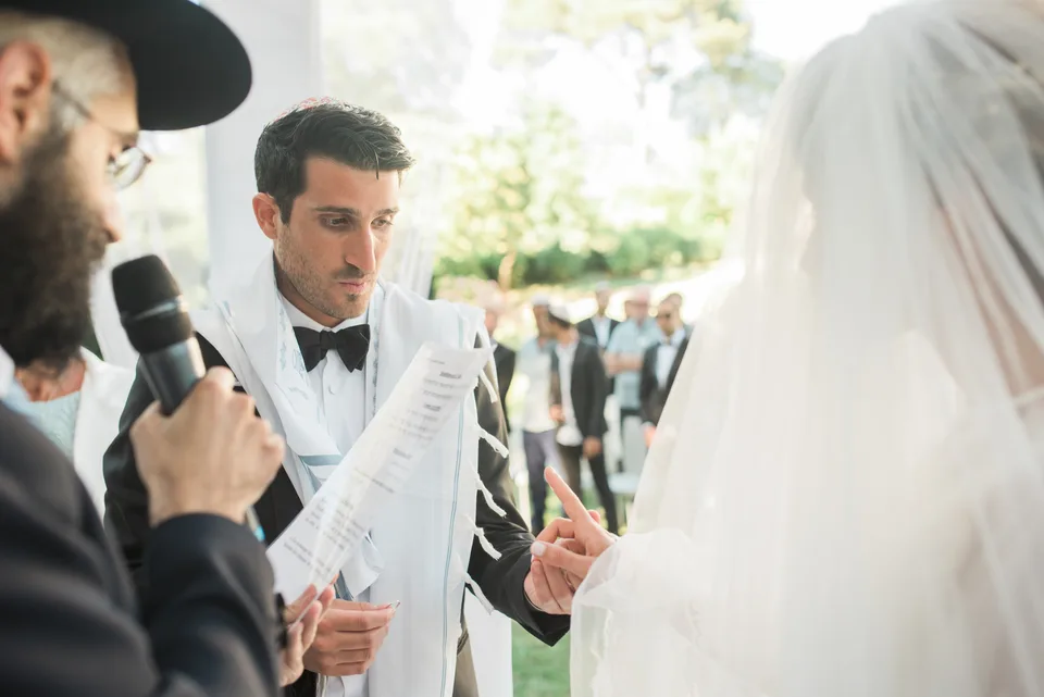 Wedding vows being read to the bride