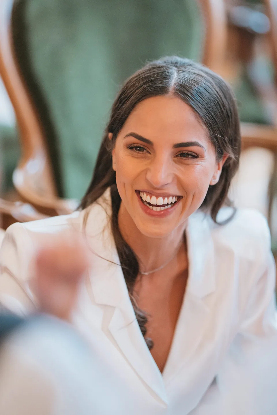 A guest laughing during the reception