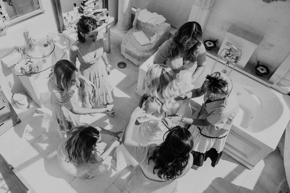 An overhead view of bridal preparations, in black and white