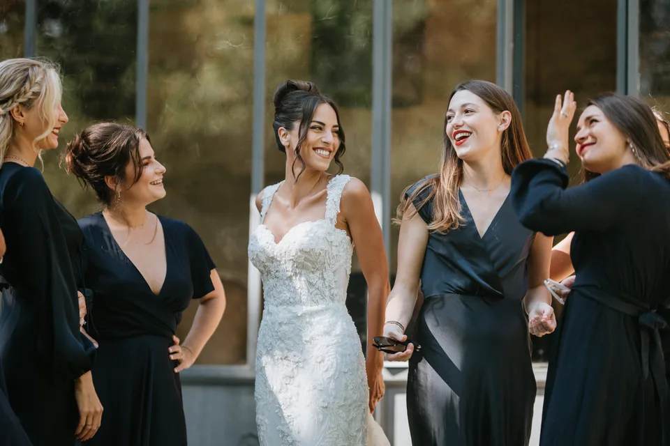 The bride laughing with loved ones