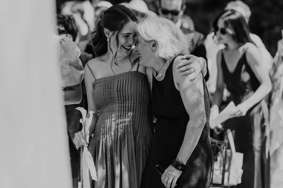 A conversation and a smile, in black and white