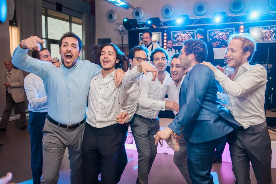 Guests raising their arms on the dance floor