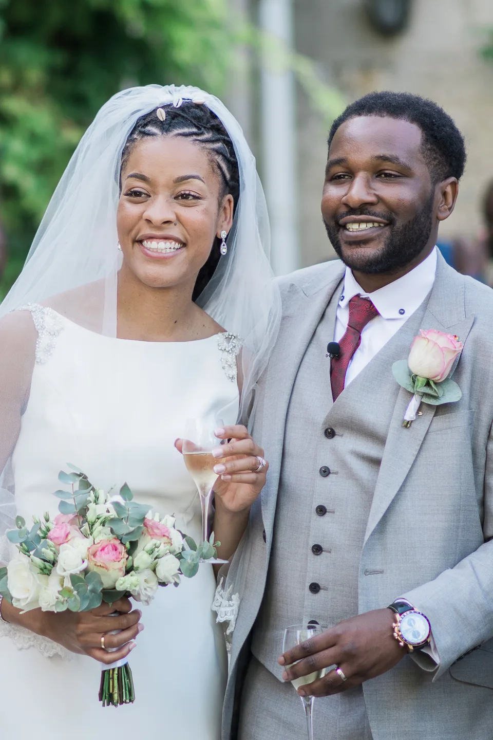 Newlyweds smiling side by side after the ceremony